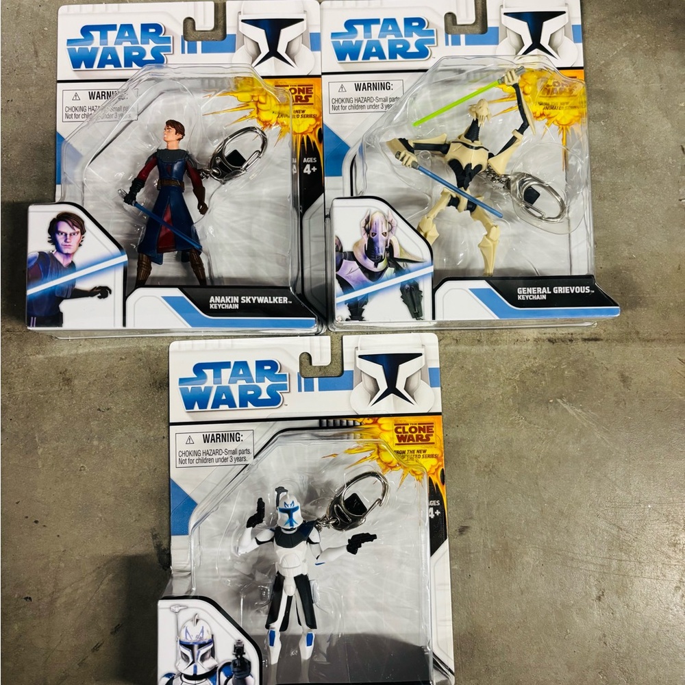 Pack of 3 Star Wars Clone Wars Action Figures - Blue, White, and Black.